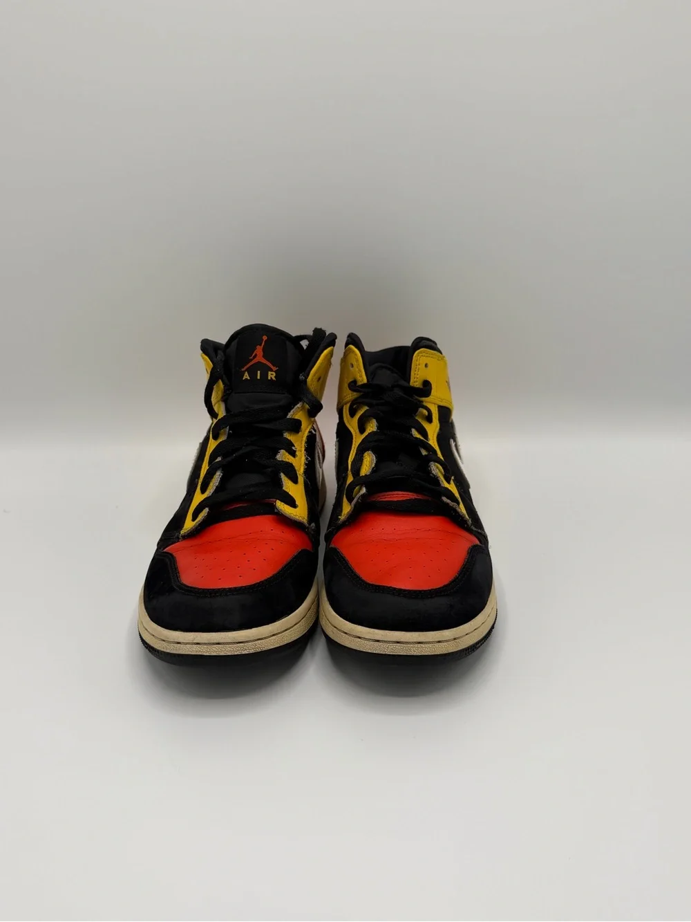 Jordan High-Top Sneakers in Black, Red & Yellow